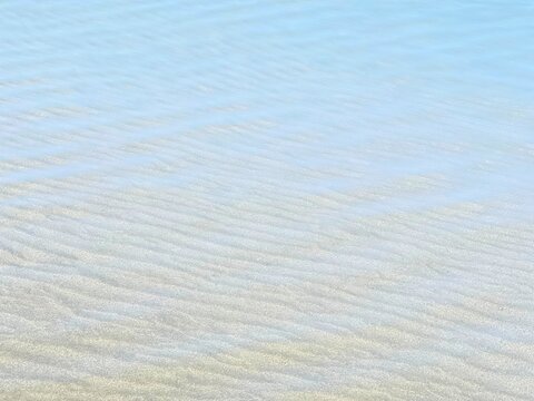 Clear sea water on sandy beach
