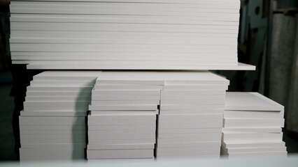 Obraz premium Samples of chipboard and MDF panels for furniture production. Selecting material when ordering furniture. Furniture panels are white, in furniture production.