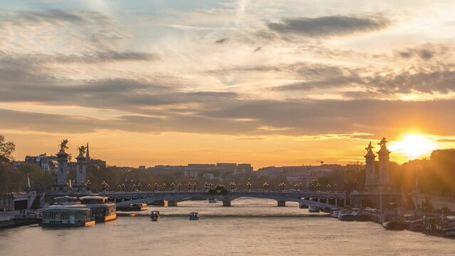 Paris France time lapse sunset city skyline at Seine River with Pont Alexandre III bridge