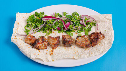 Liver kebab on plate top view