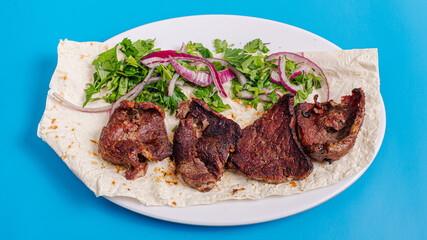 Beef kebab on plate top view