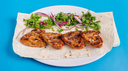 Chicken kebab on plate top view
