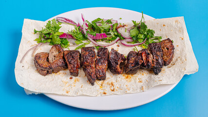 Lamb liver kebab on plate top view