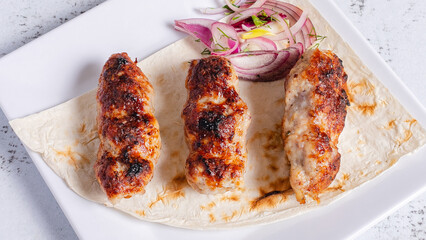 Lula kebab on plate top view