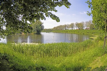 Picture over a pond on the city wall of the historic Dutch town of Brielle near Rotterdam