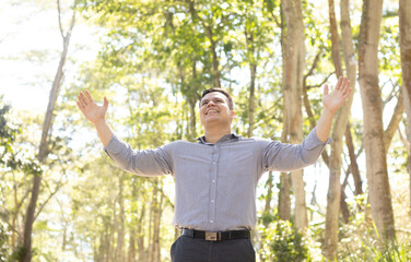 young latin man facing front with arms open