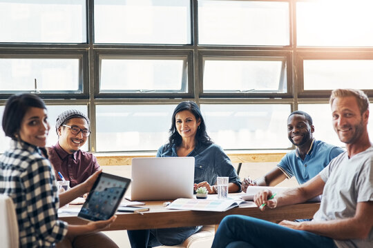 Happy, people and business meeting for planning magazine or blog article with feedback in office. Smile, freelance writers and teamwork for seo research and social media update with lens flare