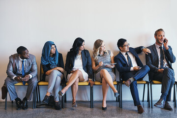 Fototapeta premium Phone call, business people and group in waiting room for recruitment, interview or hr opportunity. Chat, employees or row in office for hiring, human resources or annoyed at rude candidate on mockup
