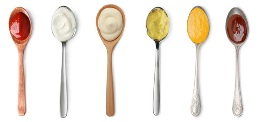 Set of different sauces in spoons isolated on white, top view