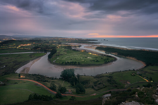 Dusk view of the meander of the Mogro estuary, Santander, Cantabria, from the top of La Picota