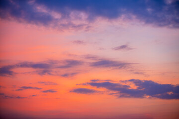 Clouds and sky in the evening,Real majestic sunrise sundown sky background with gentle colorful clouds without birds. Panoramic, big size