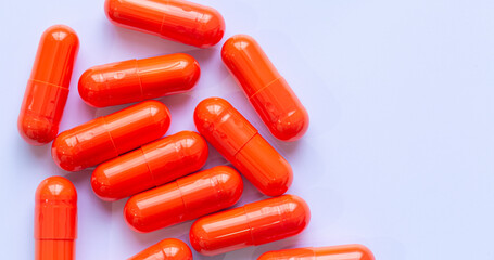 Orange capsule medicine isolated on white background,Orange capsules isolated on white background, top view.