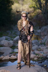 Viking warrior with sword, skull and battle bat