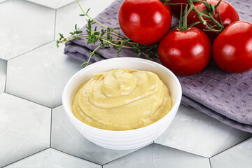 Dijon mustard sauce in the bowl