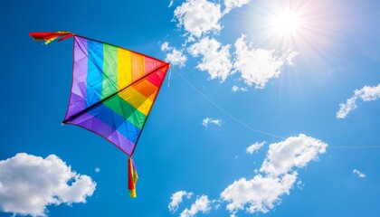 Vibrant Rainbow Kite Soaring in a Clear Blue Sky: A Close-Up View