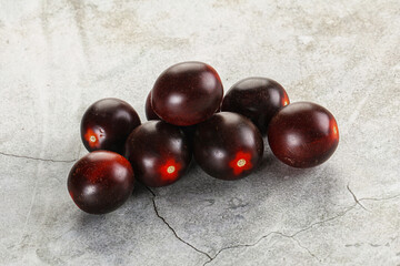 Raw ripe black kumato tomato