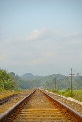 Railway tracks in rice fields. Beautiful views of rural Indonesia