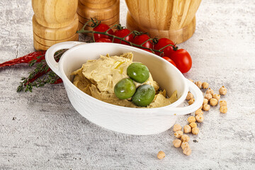 Tasty hummus with green olives