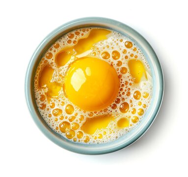 recommend clip art: A top-down view of an egg yolk in the center, surrounded by yellowish liquid with bubbles and tiny foam on a white background.