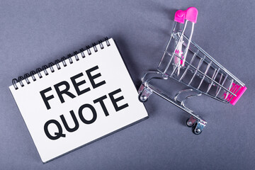 Shopping Cart Next to Notebook With Free Quote
