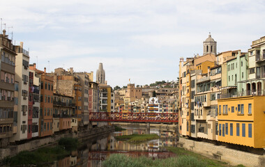 View of the old town and eiffel bridge on a summer day. Girona. Spain.