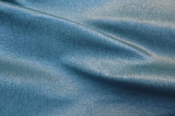 Textured Blue silk fabric. Fabric in the form of waves