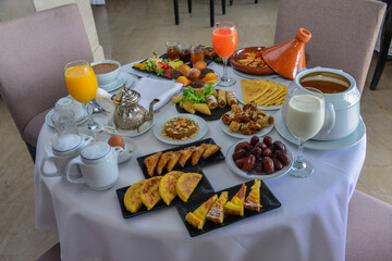 Moroccan Algerian breakfast table. Vintage background with different plates with delicious traditional middle eastern food