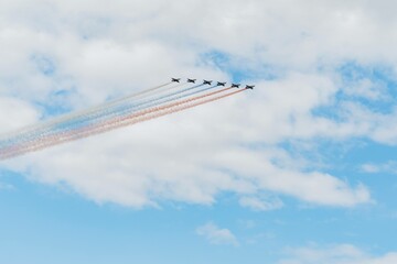 Navy day in Saint Petersburg. Russian air force planes paint the colors of the russian flag tricolour in the sky 
