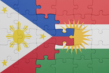 puzzle with the colourful national flag of kurdistan and flag of philippines.