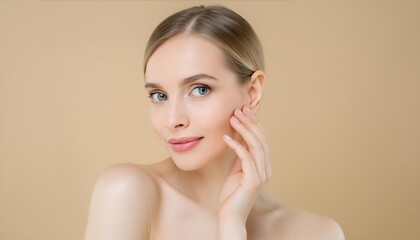 Naklejka premium beauty portrait of beautiful young woman on beige background