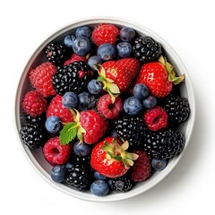 Obraz premium A bowl of juicy and fresh mixed berries top view isolated on a white background