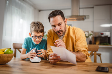 Father and son connect and install cctv security surveillance camera