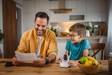 Father and son connect and install cctv security surveillance camera