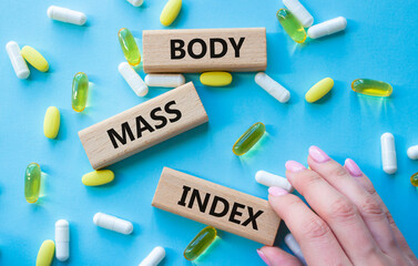 Body Mass Index symbol. Concept word Body Mass Index on wooden blocks. Doctor health. Beautiful...