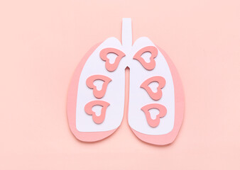 Paper lungs on pink background