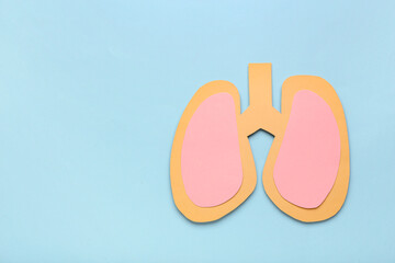 Paper lungs on blue background