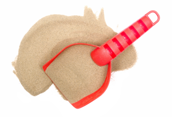 Red plastic shovel in sand, beach toy isolated on white, top view
