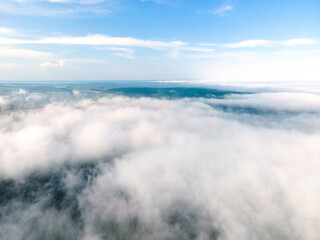 Beautiful nature white clouds Aerial view, blue sky horizon shooting from drone on sunny day high in the atmosphere front view