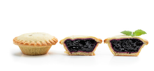 Mini berry confiture pies isolated on white