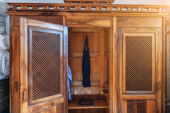 empty wooden catholic confessional with open door inside the interior of Sacred Heart of Jesus Cathedral in Tashkent in Uzbekistan