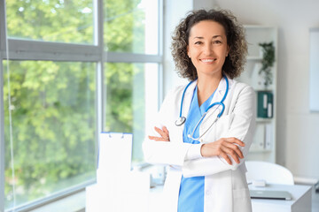 Portrait of mature female doctor in clinic