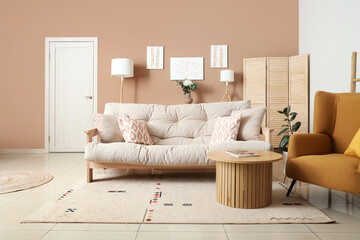 Interior of stylish living room with paintings, sofa and table