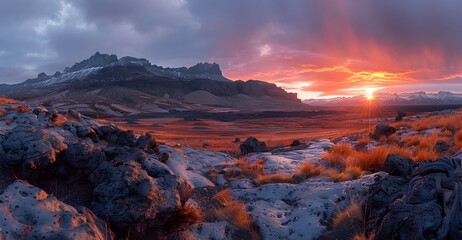 Naklejka premium A nature lava field during sunset, the sky ablaze with colors, and the terrain casting long shadows