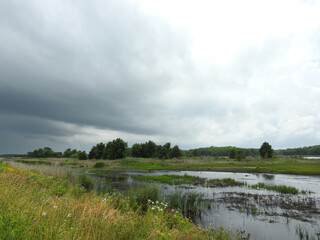 The ever changing beauty of the wetlands, as storm clouds fill the sky. Bombay Hook National Wildlife Refuge, Kent County, Delaware.