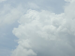 Puffy cumulus clouds forming within a blue sky over Kent County, Delaware. 
