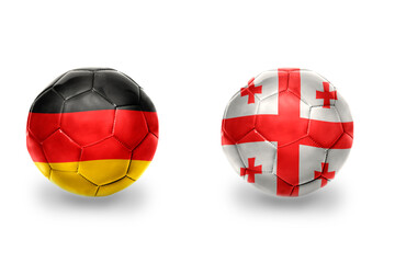 Fototapeta premium football balls with national flags of germany and georgia ,soccer teams. on the white background.
