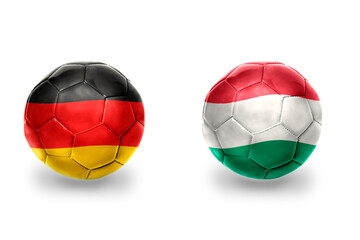 Fototapeta premium football balls with national flags of germany and hungary ,soccer teams. on the white background.