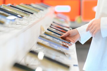 customer choosing a new mobile phone in a shop