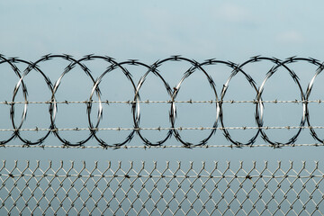 Razor wire attached to chain link fence