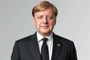 Portrait of an elderly man in a suit, showcasing a dignified and professional appearance